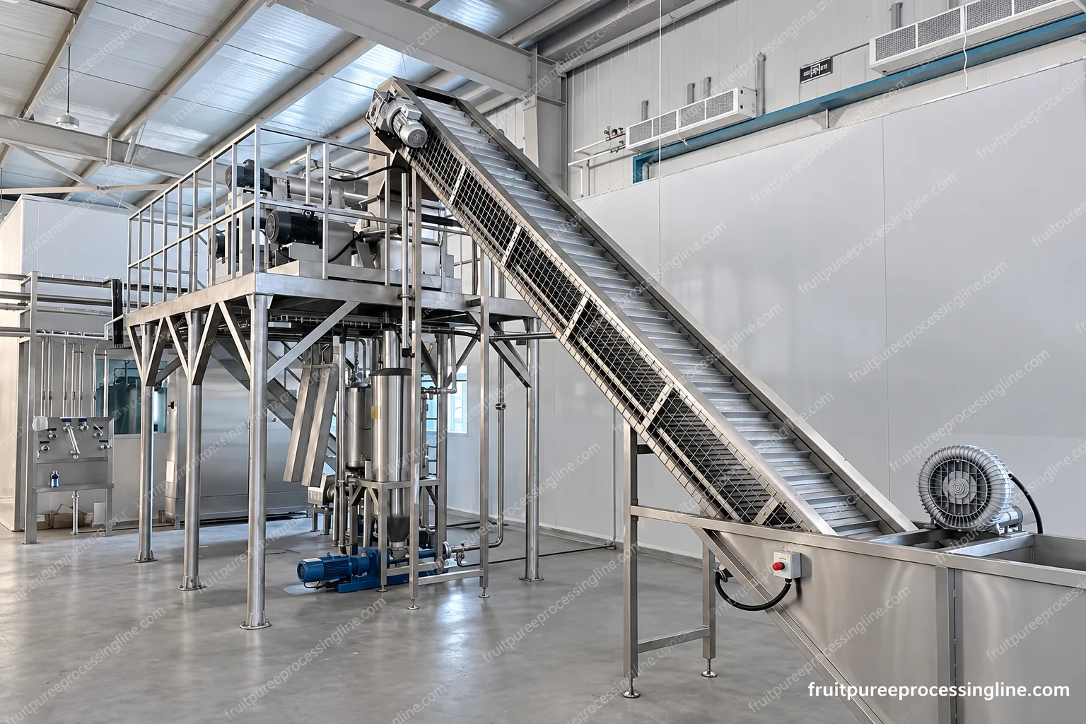 Inclined fruit conveyor with transverse belt flights, upper drive and guarded access.