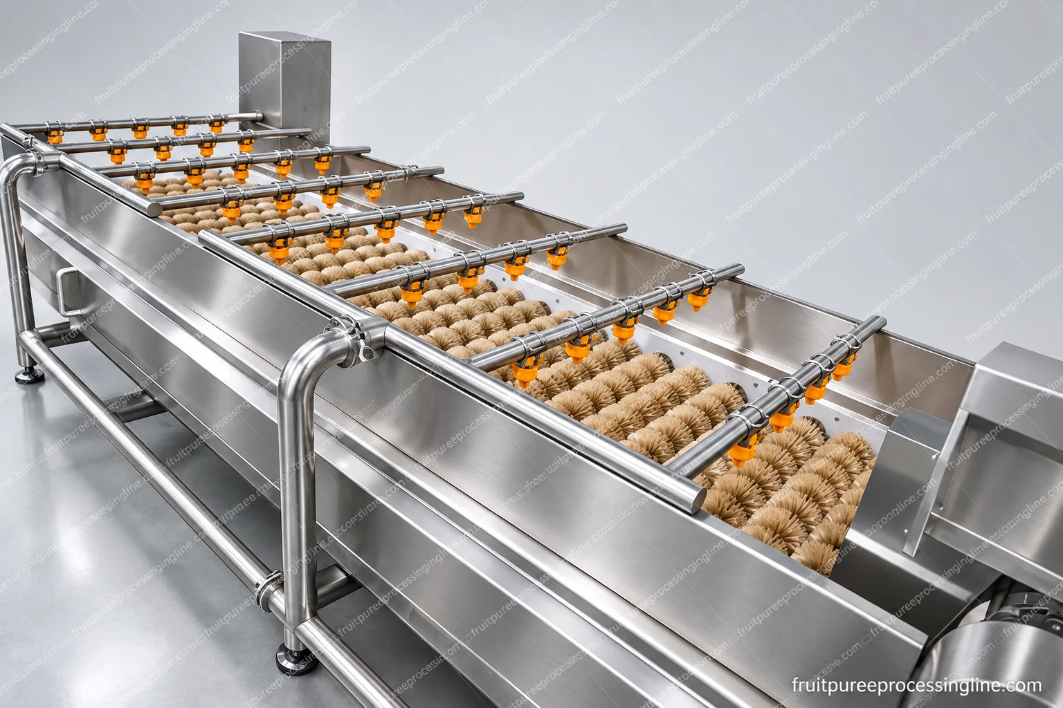 Open brush-roller washing section with spray bars above the contact area.